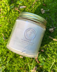 Jar of 'Summer Balm' on a grassy background