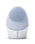 Blue silicone cleaning brush with white base on a white background